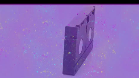 animation of distressed vintage film showing spinning video cassette