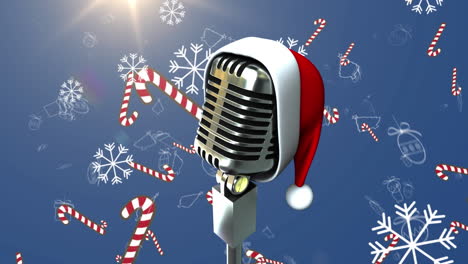 animation of retro microphone with santa hat over snow and candy canes falling on blue background