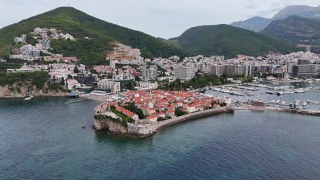 aerial drone birds eye view budva riviera old town city coastal montenegro balkan country balkans adriatic sea coastline stari grad sveti nikola island