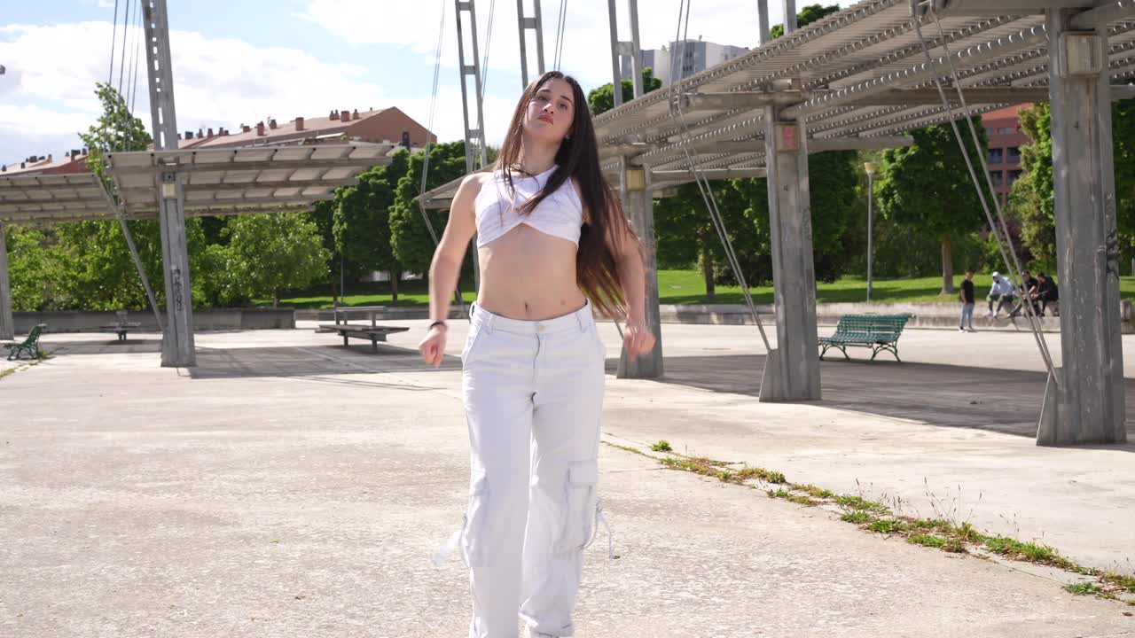 Woman dancing in urban park