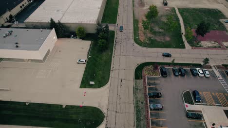 aerial-of-cars-driving-on-american-roads,-T-Intersection