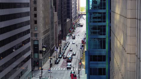 cars and buses driving through city center