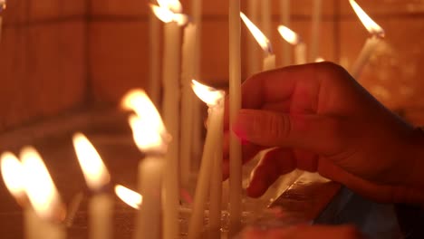 lighting prayer candles