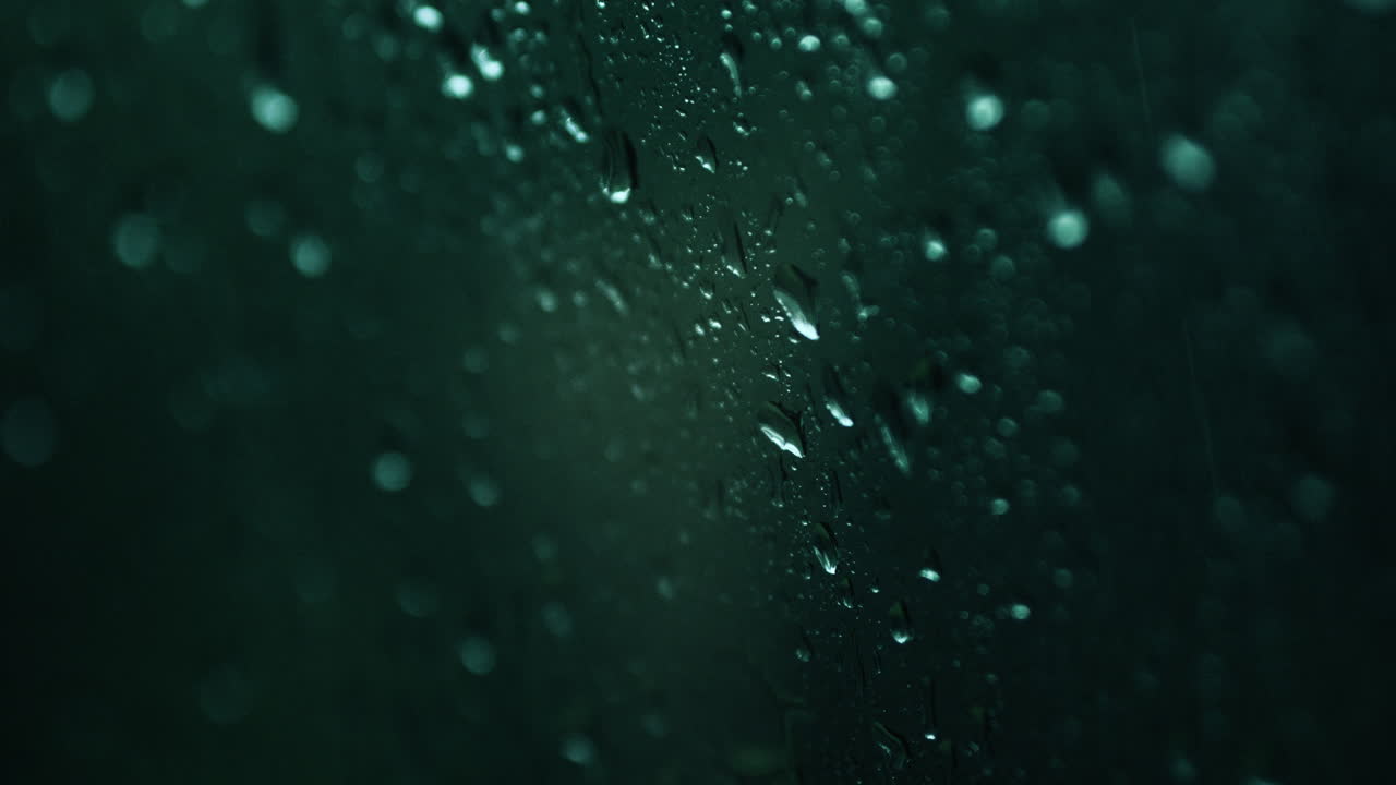 Rain on a window at night