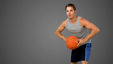 Jugador-De-Baloncesto-Pasando-La-Pelota-Sobre-Fondo-Gris