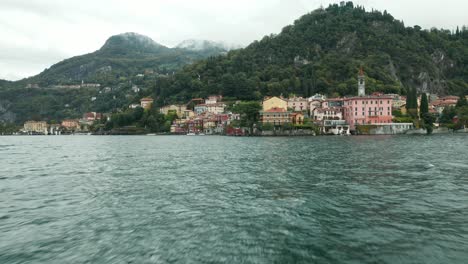 aerial: beautiful old town harbor in italian city of varenna