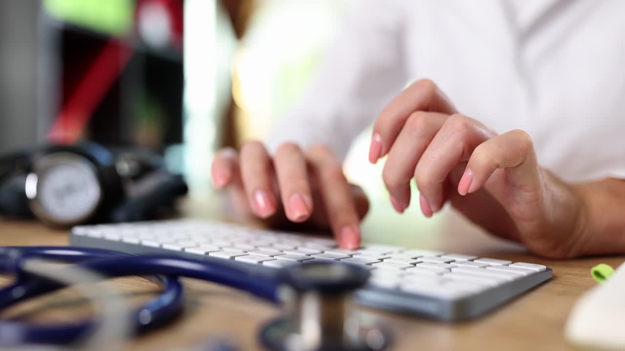 Doctor typing on a keyboard
