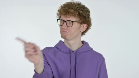 no sign with finger by redhead young man, white background