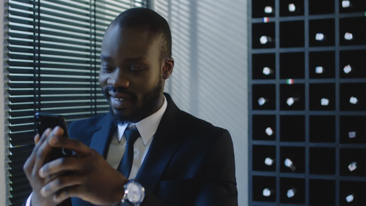 Classy Man Checking His Phone In A Restaurant
