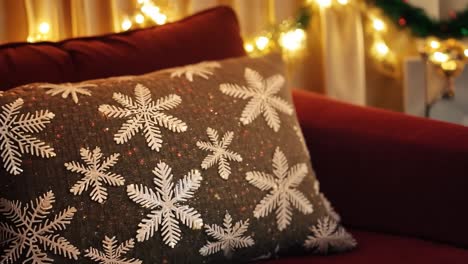 christmas decor: cozy living room with a snowflake pillow and christmas lights