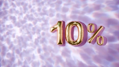 물 위에 떠다니는 황금색 10%의 물결은 분홍색 바탕에 있습니다.