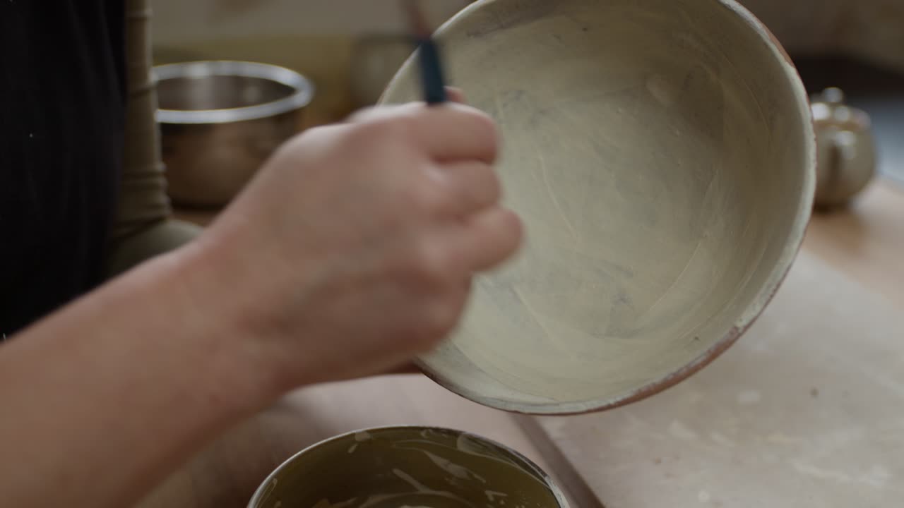 The Art of Pottery, Hands Shaping a Vessel, Crafting a Ceramic Bowl.