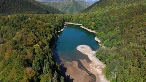 mountain lake forested biogradska gora national park - aerial pullback