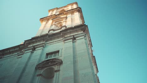 lisbon alfama ancient church convent tower ornate facade at sunrise roll shot 4k