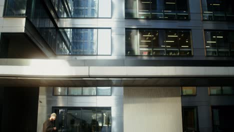 man walking in a city business district