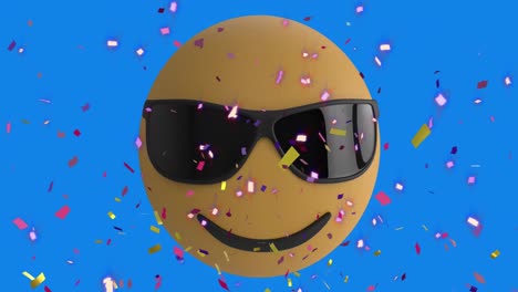 Animation-Von-Konfetti,-Die-über-Das-Emoji-Symbol-Fällt,-Mit-Sonnenbrille,-Die-Sich-Auf-Blauem-Hintergrund-Bewegt