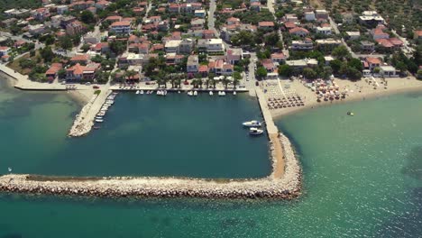 Aerial-cable-cam-shot-of-Skala-Sotiros-resort-on-Thassos-island,-Greece