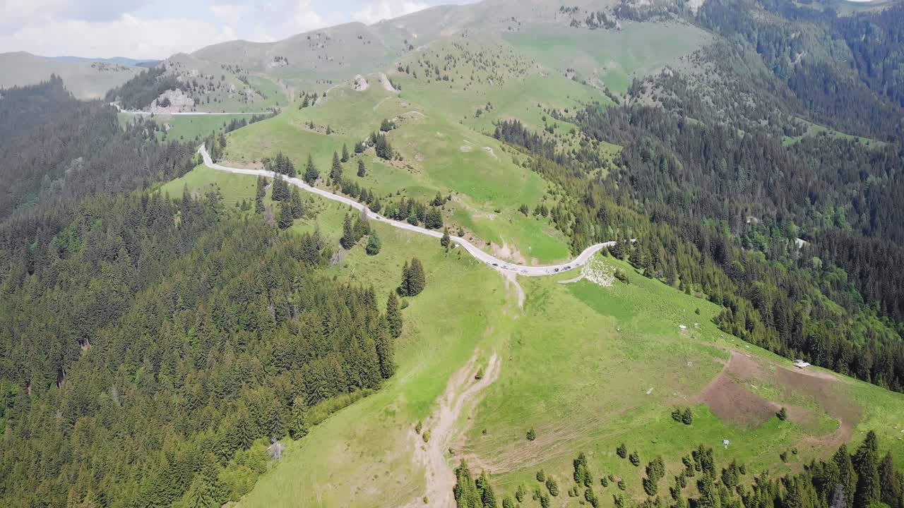 Aerial shot of a road in the mountains. Bucegi, Romania
