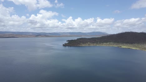 calm waters of quaids dam, reservoir near big mitchell creek reserve in queensland, australia