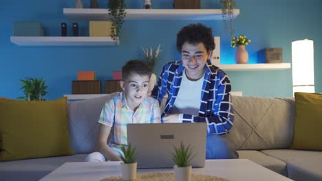 Two-teenage-boys-watching-scary-videos-on-laptop.