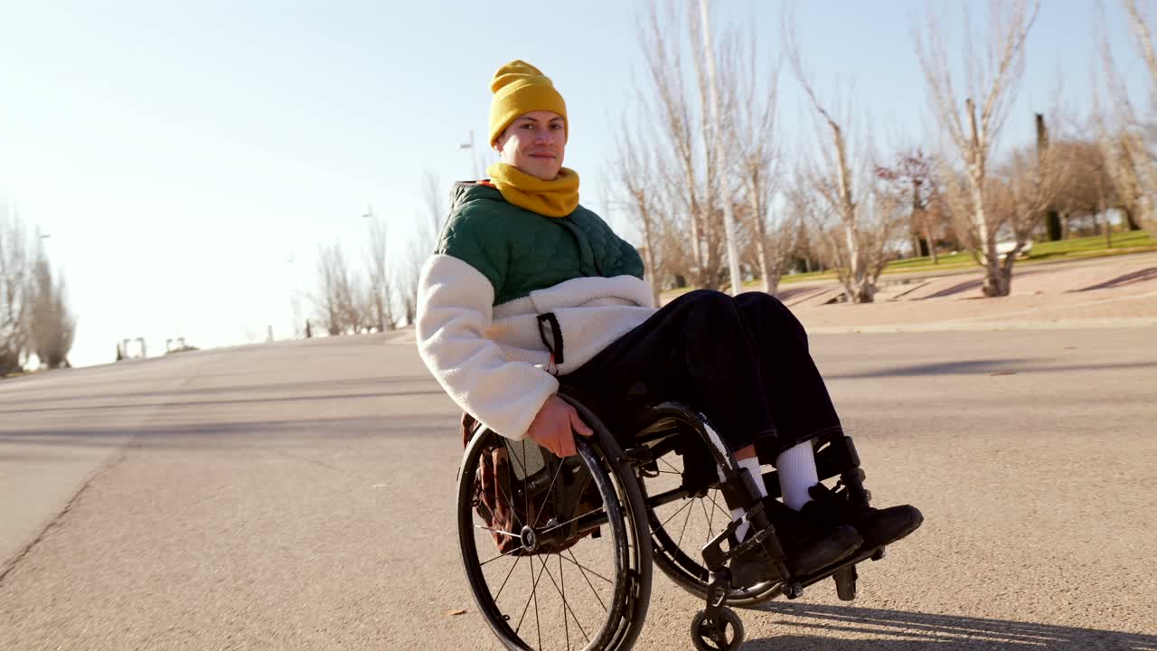 Man in wheelchair on road