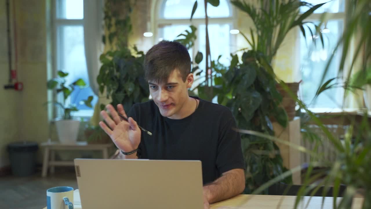 Young european Male Student doing virtual meeting