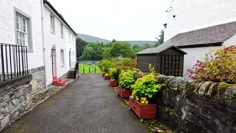 scenic garden path beside historic building in dunkeld