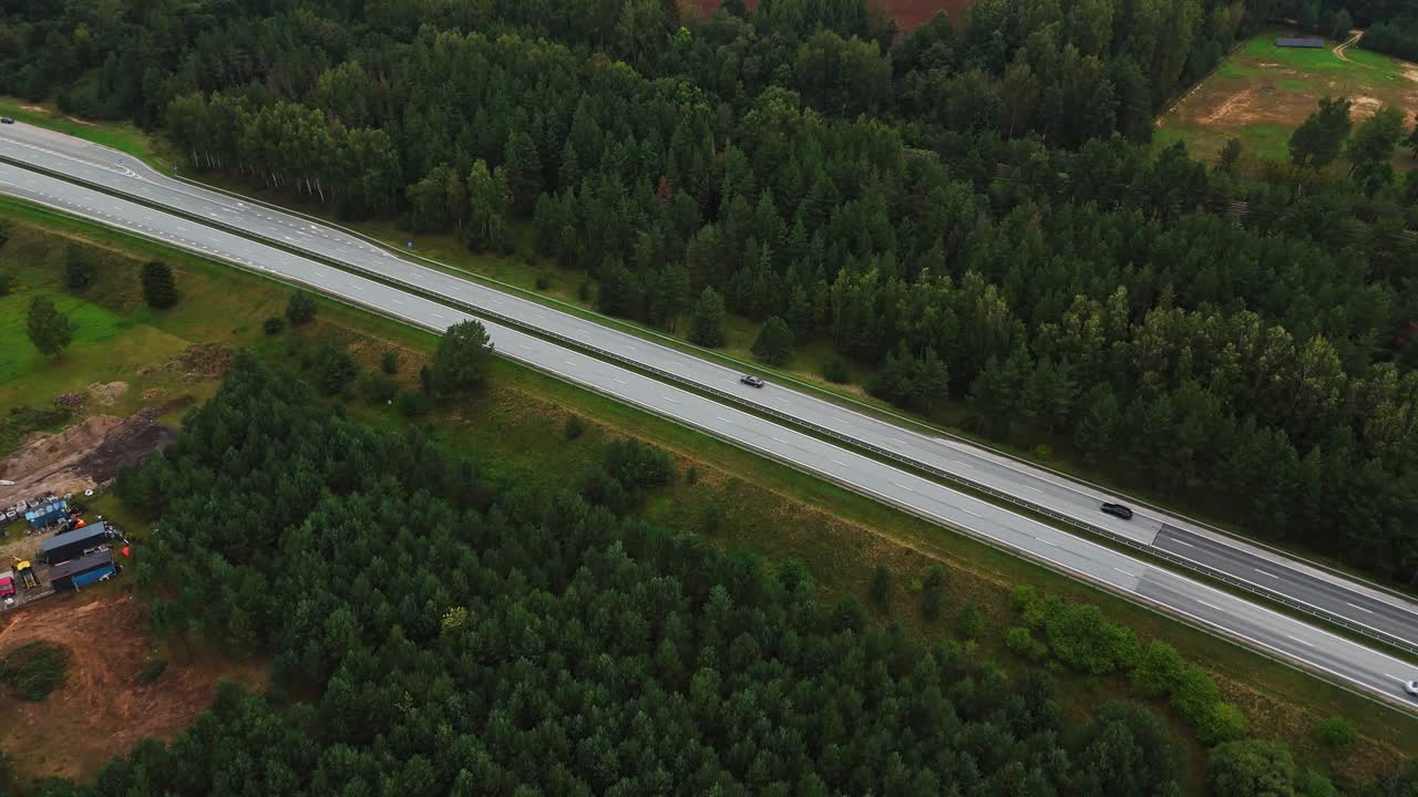 Drone view of Ikskile countryside with highway and lush forested area