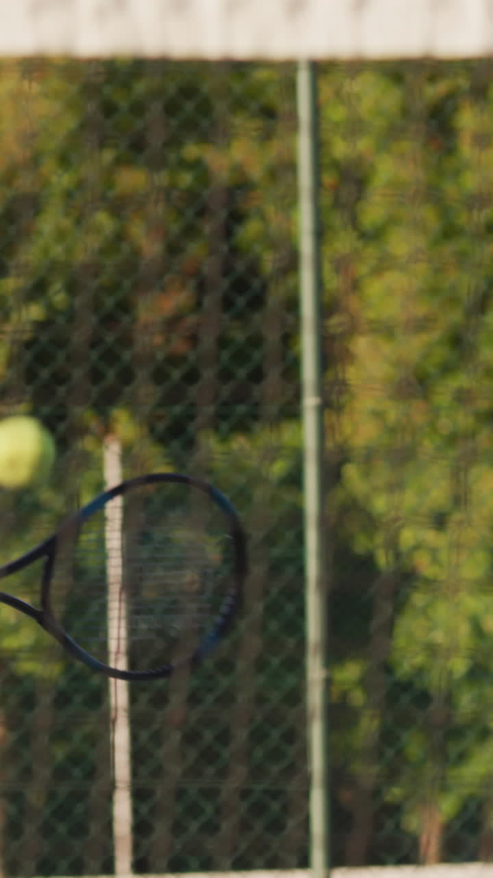 Video of focused caucasian female tennis player holding racket and hitting ball