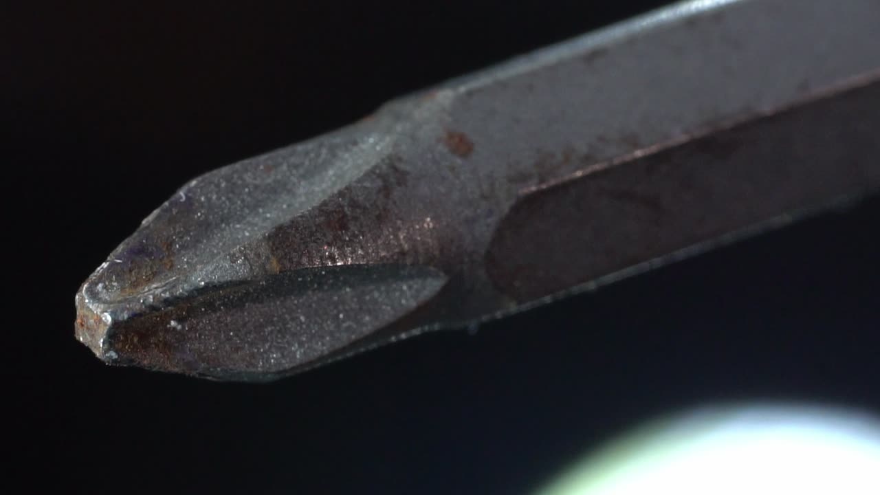 Macro Of Phillips Screwdriver Bit. - slow zoom out