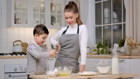 mother and son baking together