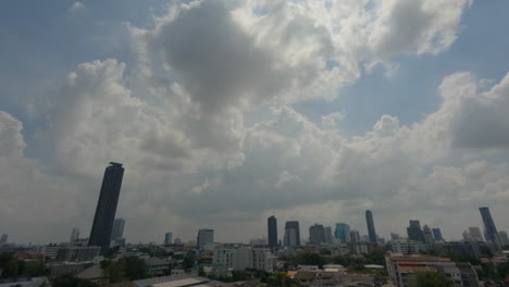 dark clouds over cityscape of phrom phong, khwaeng khlong tan nuea, watthana, bangkok, thailand. timelapse