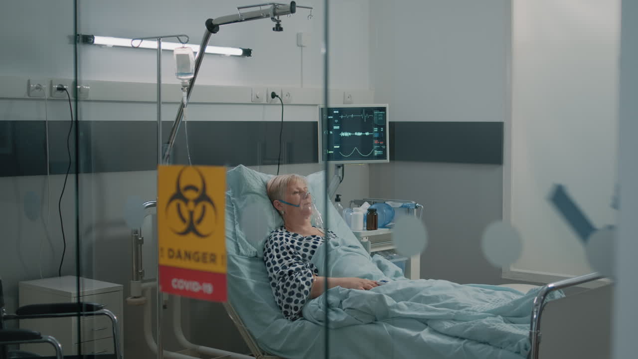 Medic wearing hazmat suit doing consultation for patient