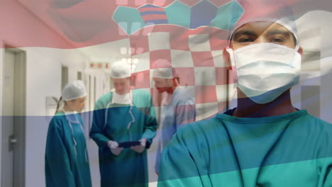 animation of flag of croatia waving over surgeons in operating theatre