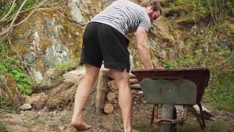 gardener placing root rot on raised garden bed