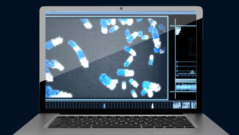 pantalla de computadora portátil que muestra el video de las pastillas que caen