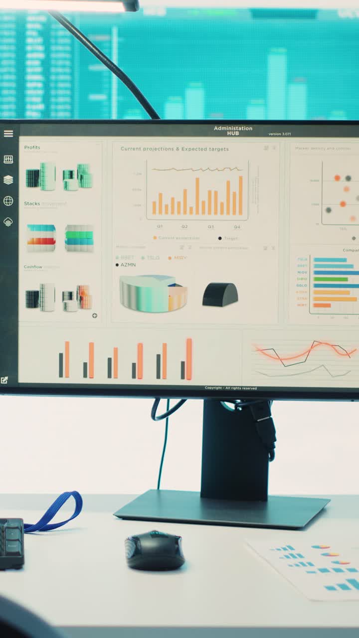 Computer Monitors Displaying Business Data and Financial Charts