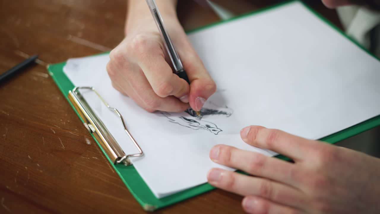 Careful painting of lower mouth and jaw region on canvas with soft brush strokes capturing anatomical detail in focused closeup as hand moves with precision over wet oil pigment blending light shadow