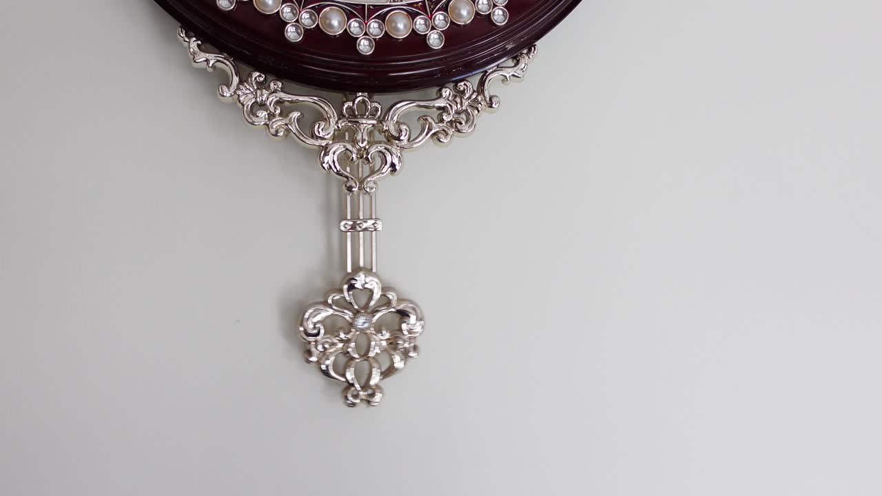 Ornate Wall Clock with Decorative Pendulum