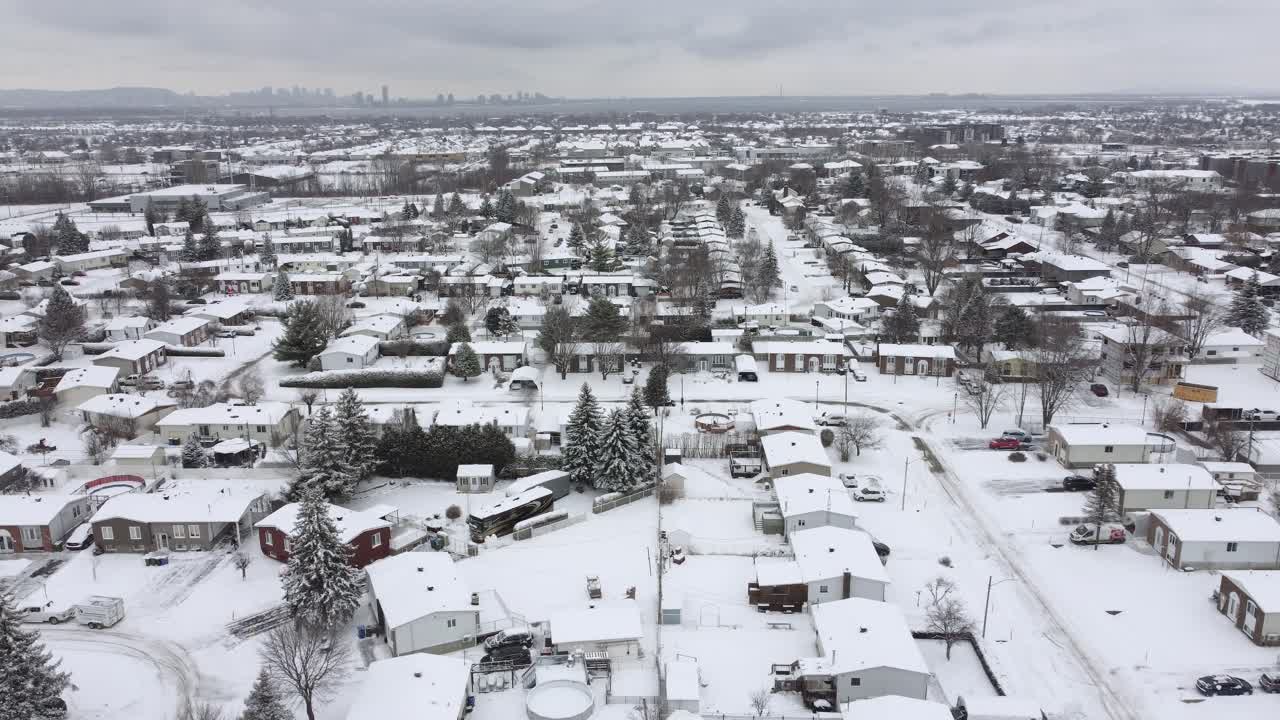 Winter in Canada North America snow covered suburban neighborhood houses aerial landscape