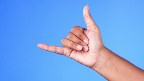 Hand,-gesture-and-shaka-with-a-person-in-studio