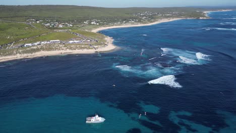 Panoramic-view-of-ocean-blue-and-beach-at-Margaret-River-during-surf-league-competition-event,-Australia