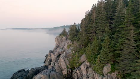 beautiful shot of maine's bold coast revealing mist on ocean at sunrise