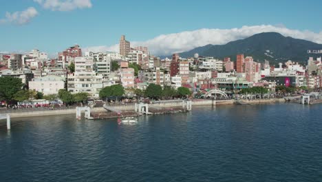 Sunny-Aerial-View-of-Tamsui-Riverside-Park,-Taipei