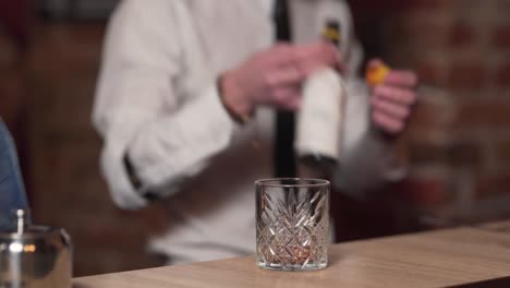 two bartenders making a cocktail