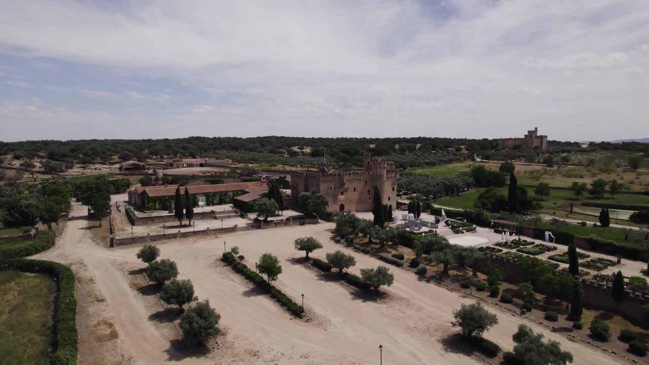 Aerial view circling the castle of Arguijuelas de Abajo scenic grounds and courtyard in the city of C&aacute;ceres