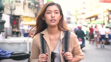 young tourist walking and sightseeing in bangkok, thailand