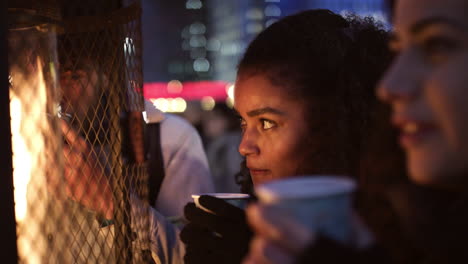 friends drinking mulled wine at christmas market