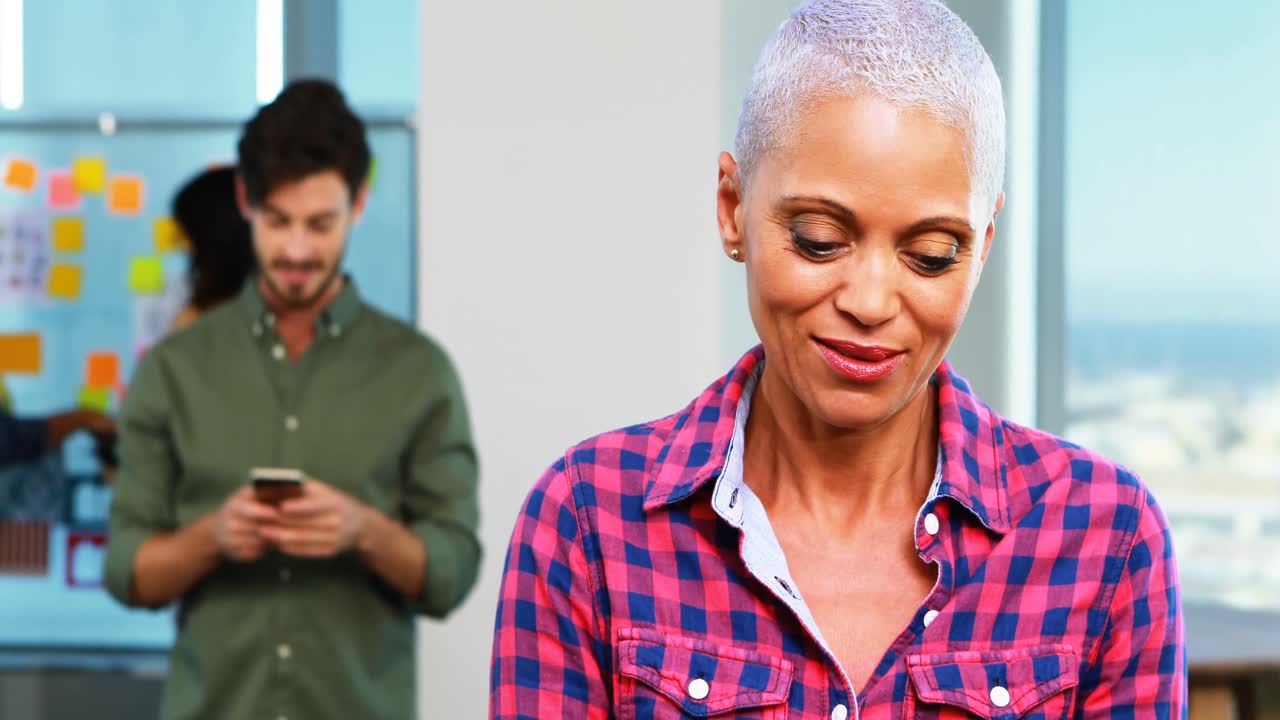 Female executive using digital tablet in office