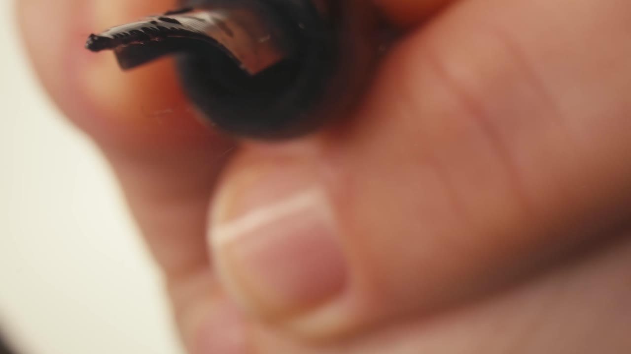 Close-up of Hand Writing the Word 'Peace' with a Pen